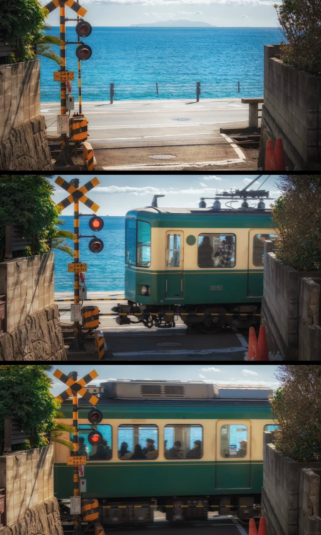 The green Enoden train passing a seaside railway crossing with the ocean behind, Kamakura