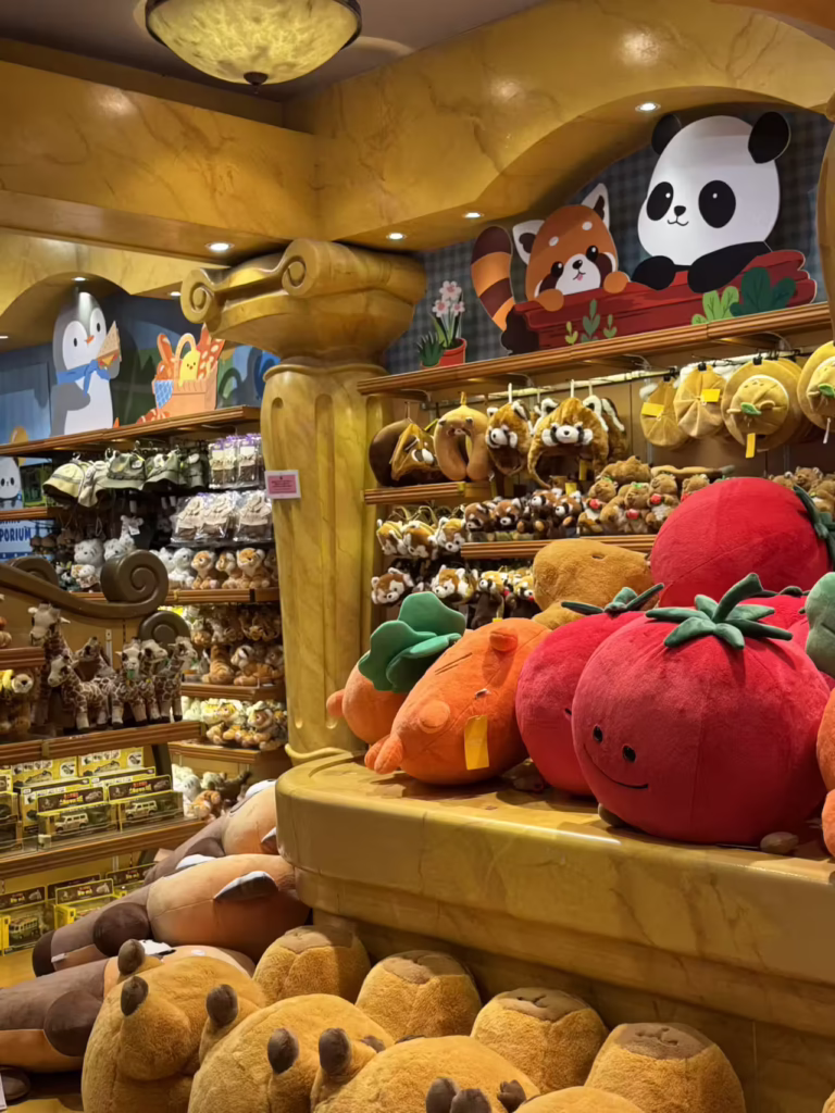 Shelves of plush capybaras, tomatoes and red pandas in an Everland gift shop
