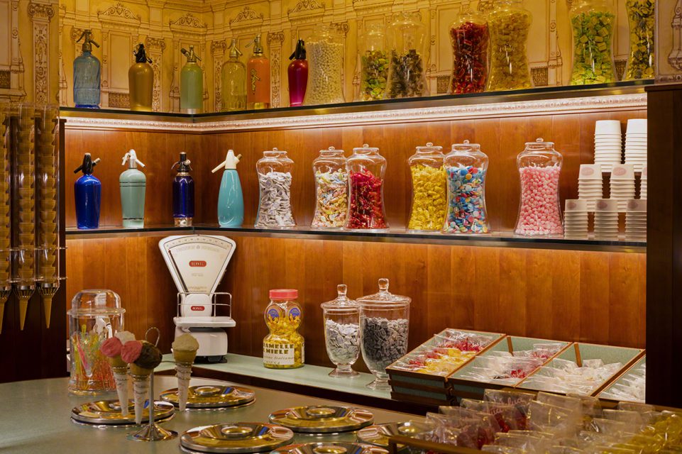 Vintage-style interior of Bar Luce at Fondazione Prada, with candy jars and seltzer bottles