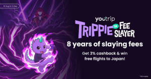 Trippie the dragon holding a YouTrip card in purple flames beside the Trippie the Fee Slayer campaign title