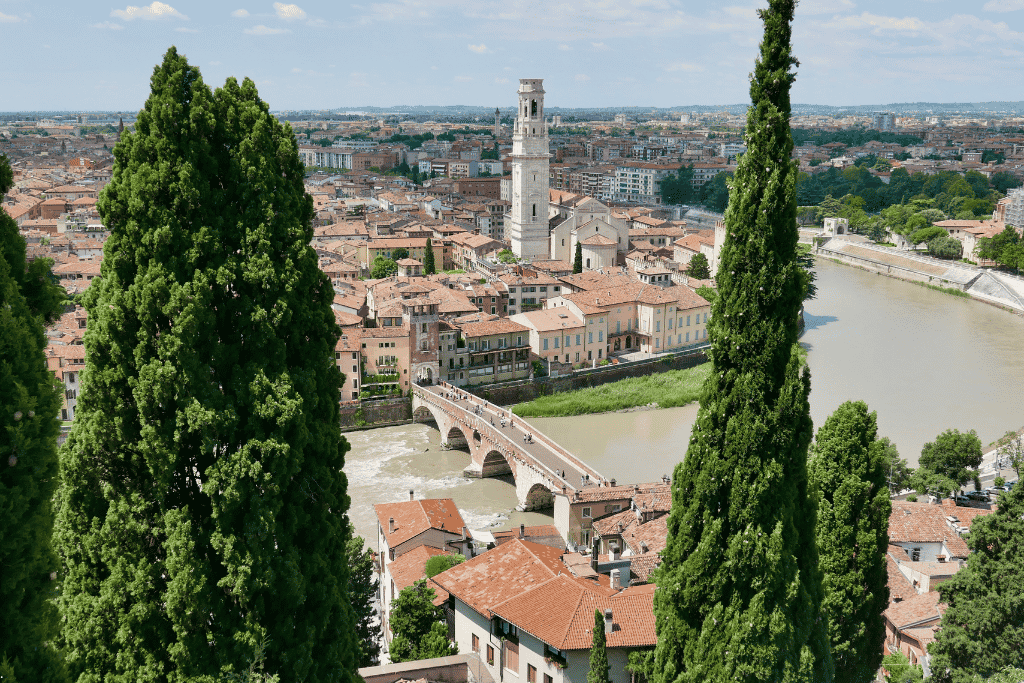 View over Verona's terracotta rooftops, the Adige river and the arched Ponte Pietra