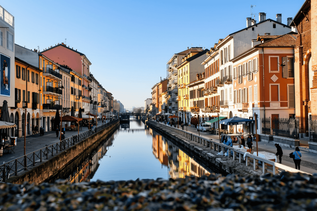 Milan's Naviglio Grande canal lined with pastel buildings and reflections