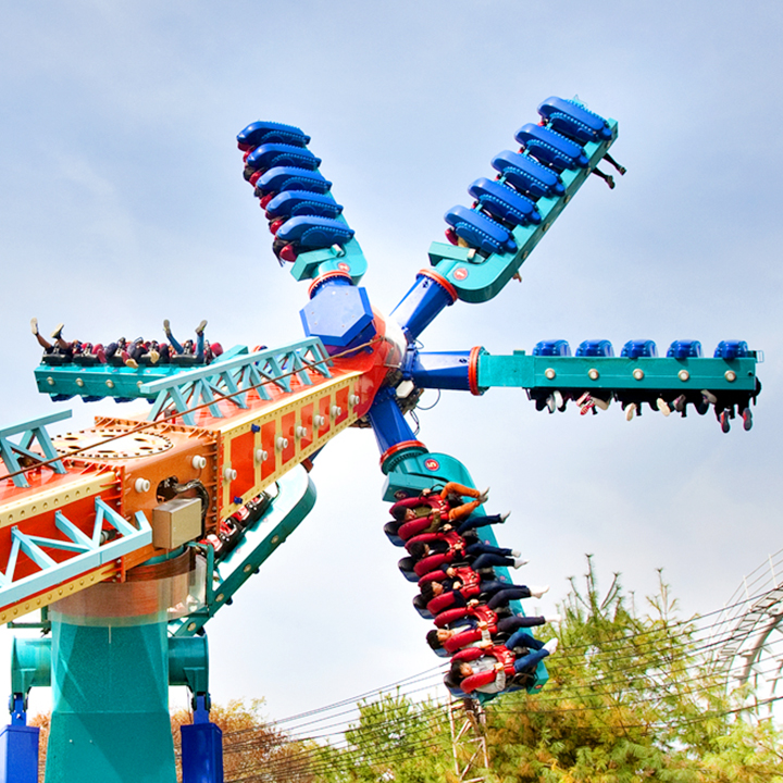 Riders spin on the outstretched arms of Everland's Let's Twist rotating flat ride