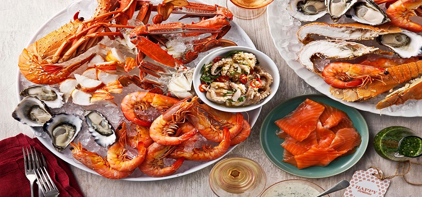 Chilled seafood platter with lobster, crab legs, oysters, prawns and smoked salmon
