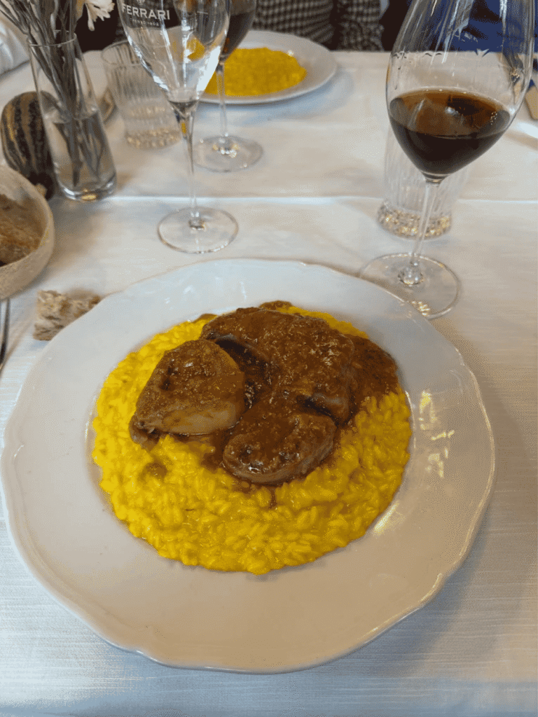 Braised ossobuco veal shank served over saffron risotto alla Milanese