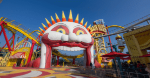 The grinning sun-face entrance archway to the Hair Raiser roller coaster at Ocean Park's Thrill Mountain