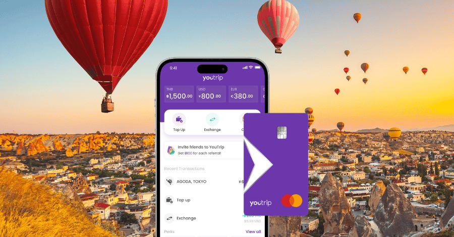 The YouTrip app and purple YouTrip Mastercard against a Cappadocia balloon sunset