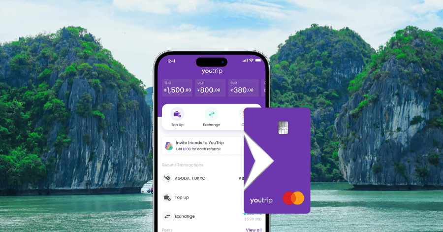 YouTrip app showing multi-currency balances beside the purple YouTrip Mastercard, Ha Long Bay behind