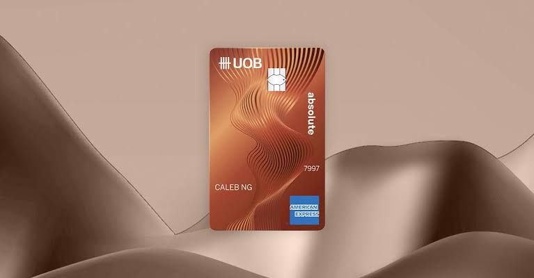 Copper UOB Absolute Cashback American Express card with a rippled wave pattern