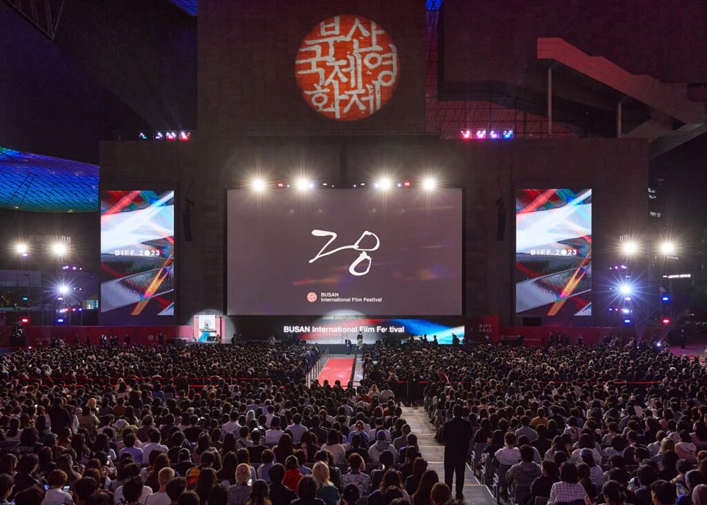 A packed crowd at the Busan International Film Festival's outdoor opening ceremony at night