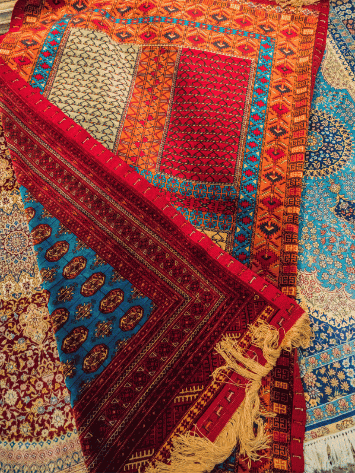 Hand-knotted wool carpets for sale in a Bukhara carpet shop