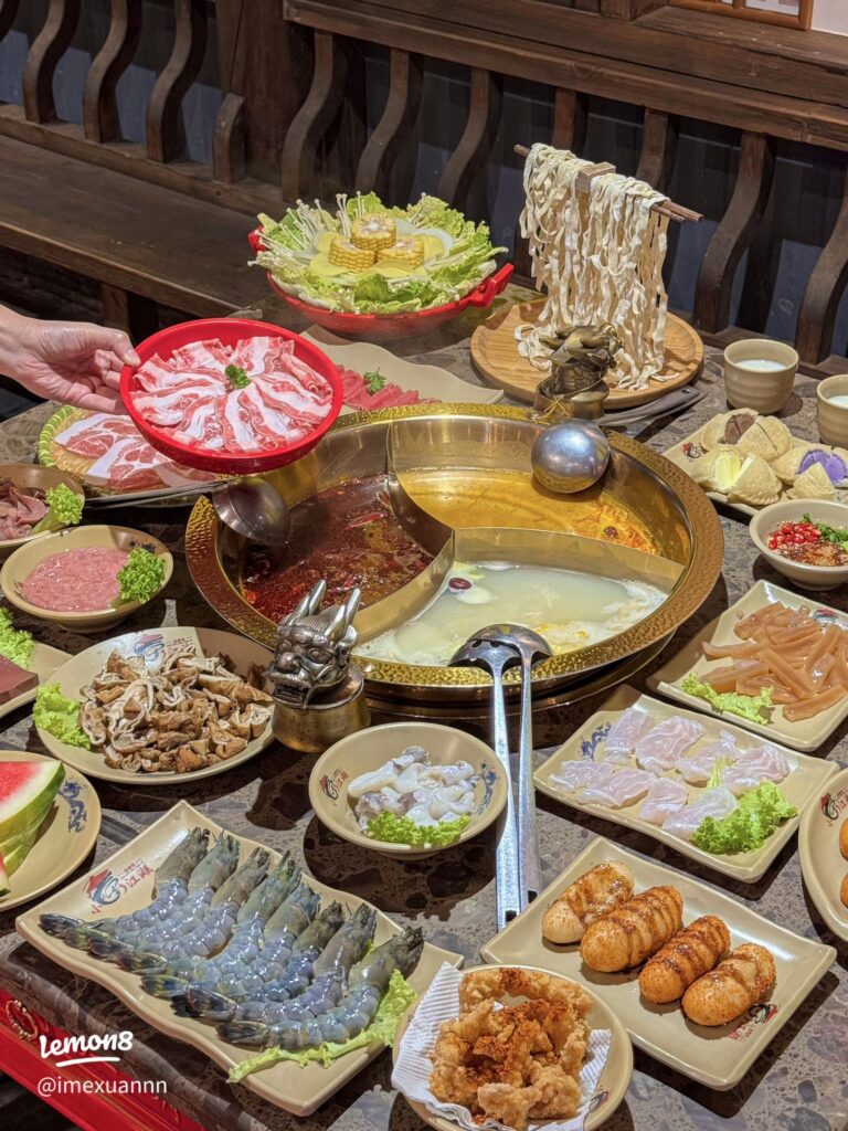 Dragon-motif hotpot with twin broths, sliced meats, and noodles at Dragon's Journey Hotpot in Johor Bahru