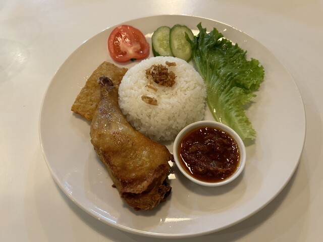 A plate of Indonesian fried chicken, rice, and sambal
