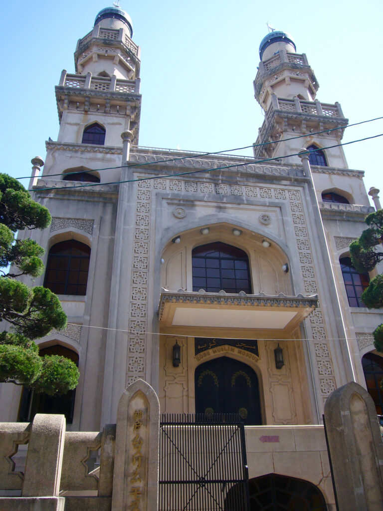 Kobe Mosque's twin square minarets and Indo-Islamic facade