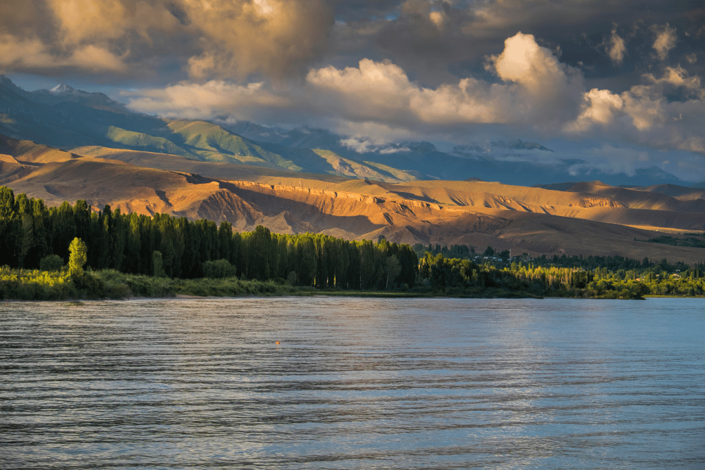 Lake Issyk-Kul's blue water ringed by snow-capped mountains