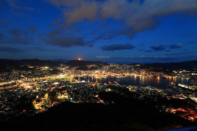 Nagasaki's harbour and hillside lights seen from Mount Inasa at night