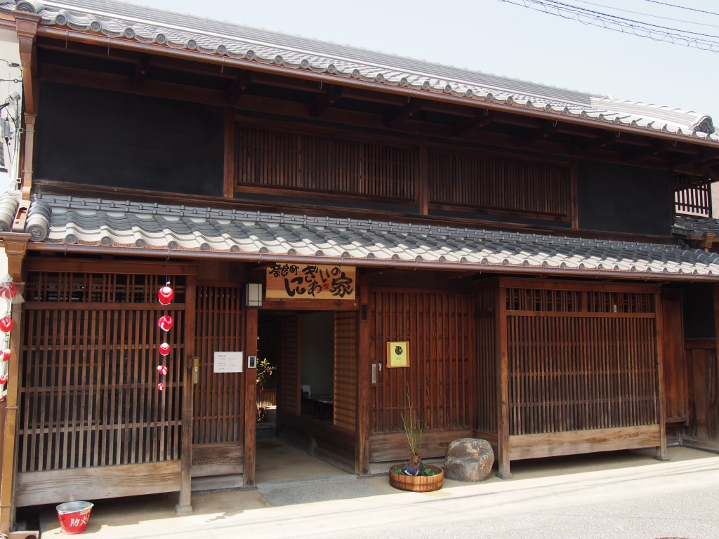 The traditional wooden entrance of Naramachi Nigiwai no Ie, a restored century-old townhouse