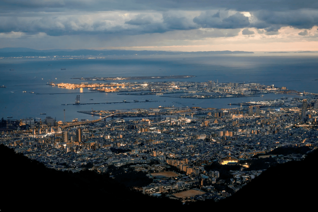 Panoramic dusk view of Kobe and Osaka Bay from Mount Rokko