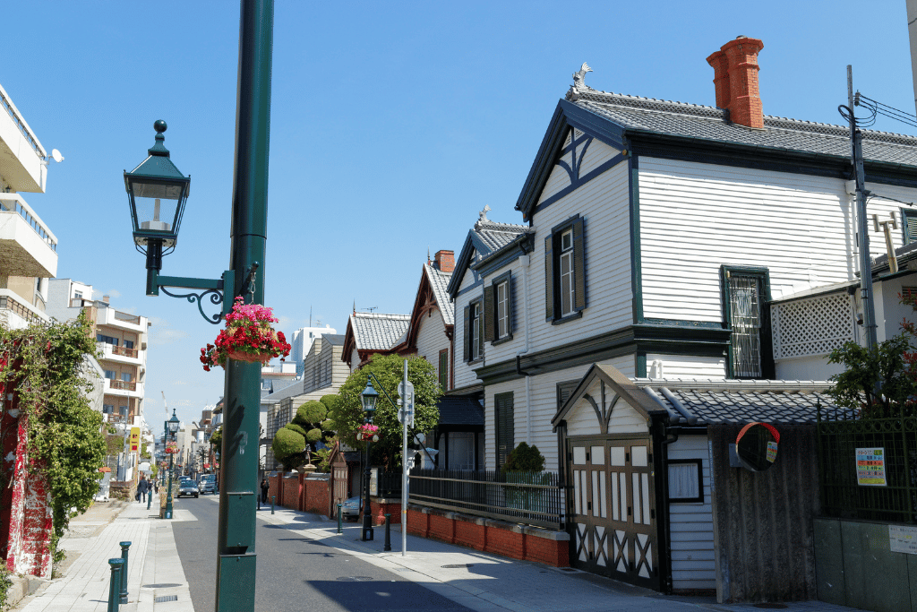 A sunny street in Kobe's Kitano district lined with Western-style mansions