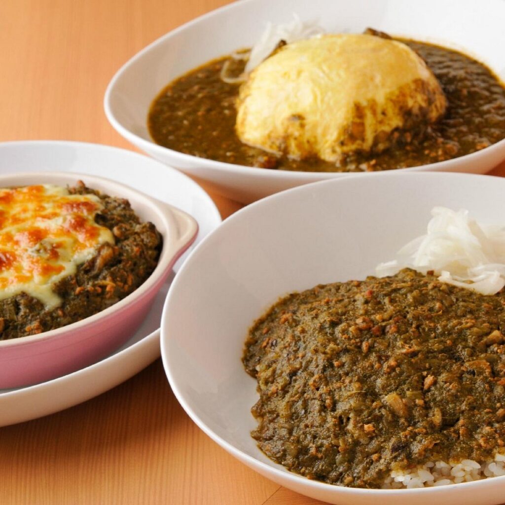 Three bowls of different curry styles served at Wakakusa Curry in Nara
