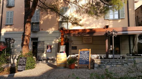 Al Prato restaurant's shaded courtyard entrance in Varenna