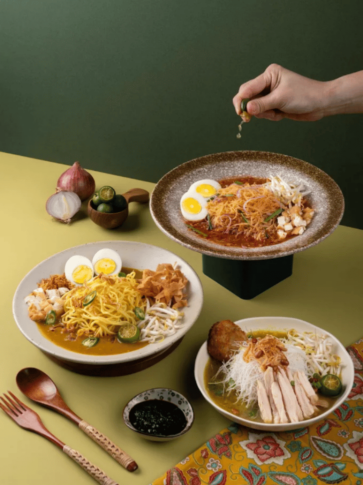 Bowls of curry mee with boiled egg and shredded chicken at Tea Garden