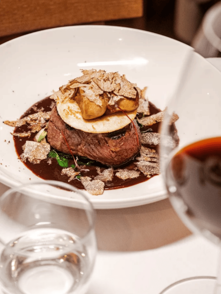Truffle-topped beef fillet plated at L'Antica Trattoria in Como