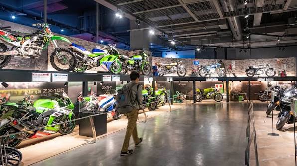 Rows of Kawasaki motorbikes on display inside Kawasaki Good Times World