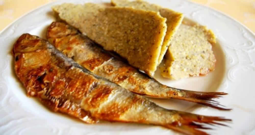 Missoltini, sun-dried lake fish, served with polenta