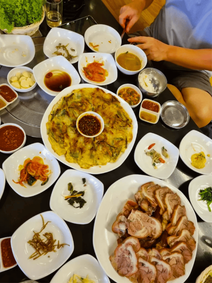 Korean pancake and sliced pork belly with banchan at Nam Moon Korean BBQ