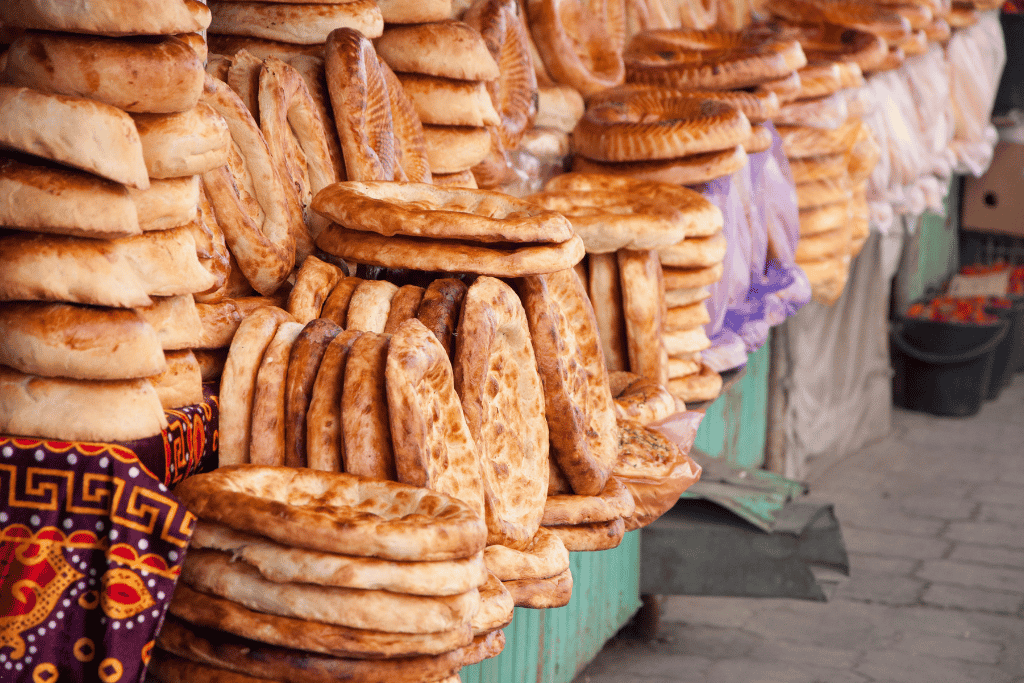 Stalls piled with produce and goods at Osh Bazaar, Bishkek's largest local market