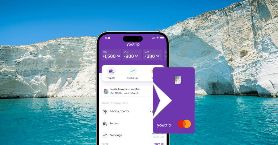 YouTrip app and card mockup in front of Greece's white cliffs and turquoise sea