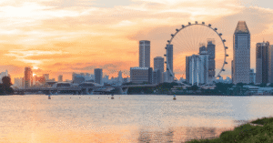 Singapore skyline at sunset with the Singapore Flyer and Marina Bay towers