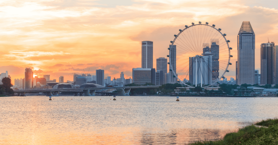 Singapore skyline at sunset with the Singapore Flyer and Marina Bay towers