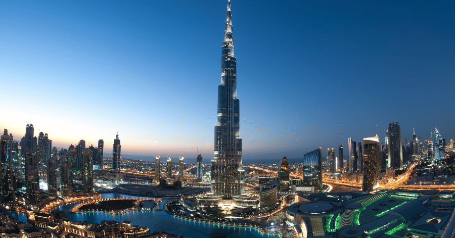 Burj Khalifa and the Downtown Dubai skyline lit up at dusk