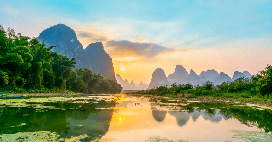 Golden sunrise over the Li River and its karst peaks