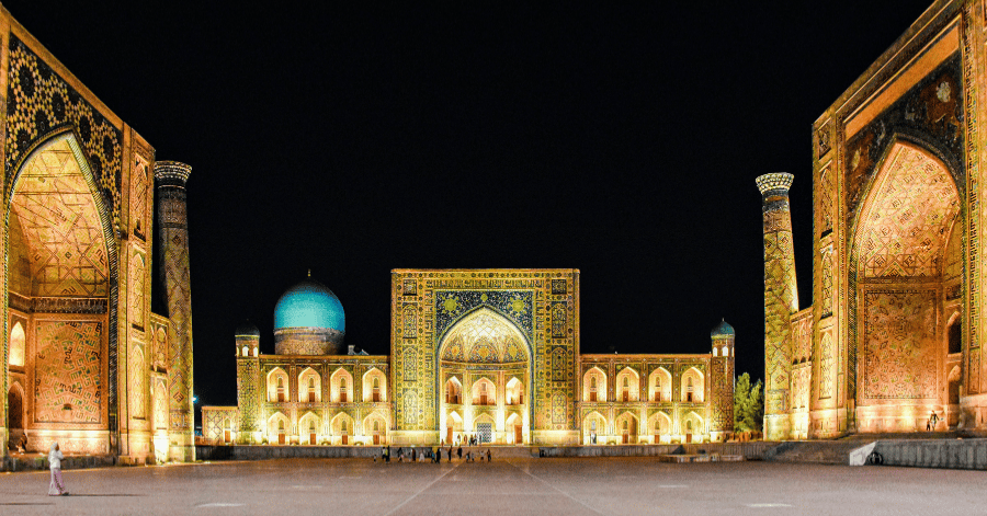 The three floodlit madrasas of Registan Square in Samarkand at night