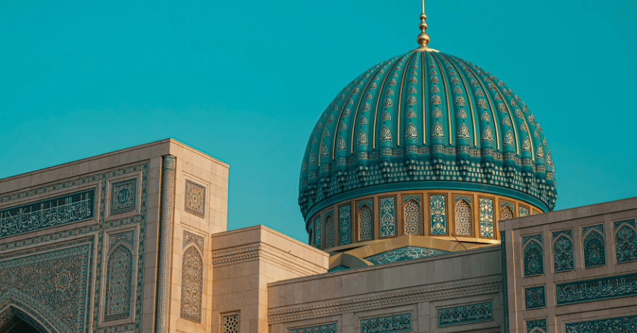 Close-up of a turquoise and gold ribbed dome on an Islamic monument in Uzbekistan