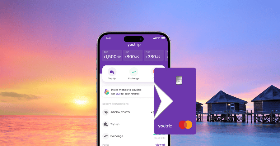 YouTrip app and card mockup in front of overwater villas at sunset