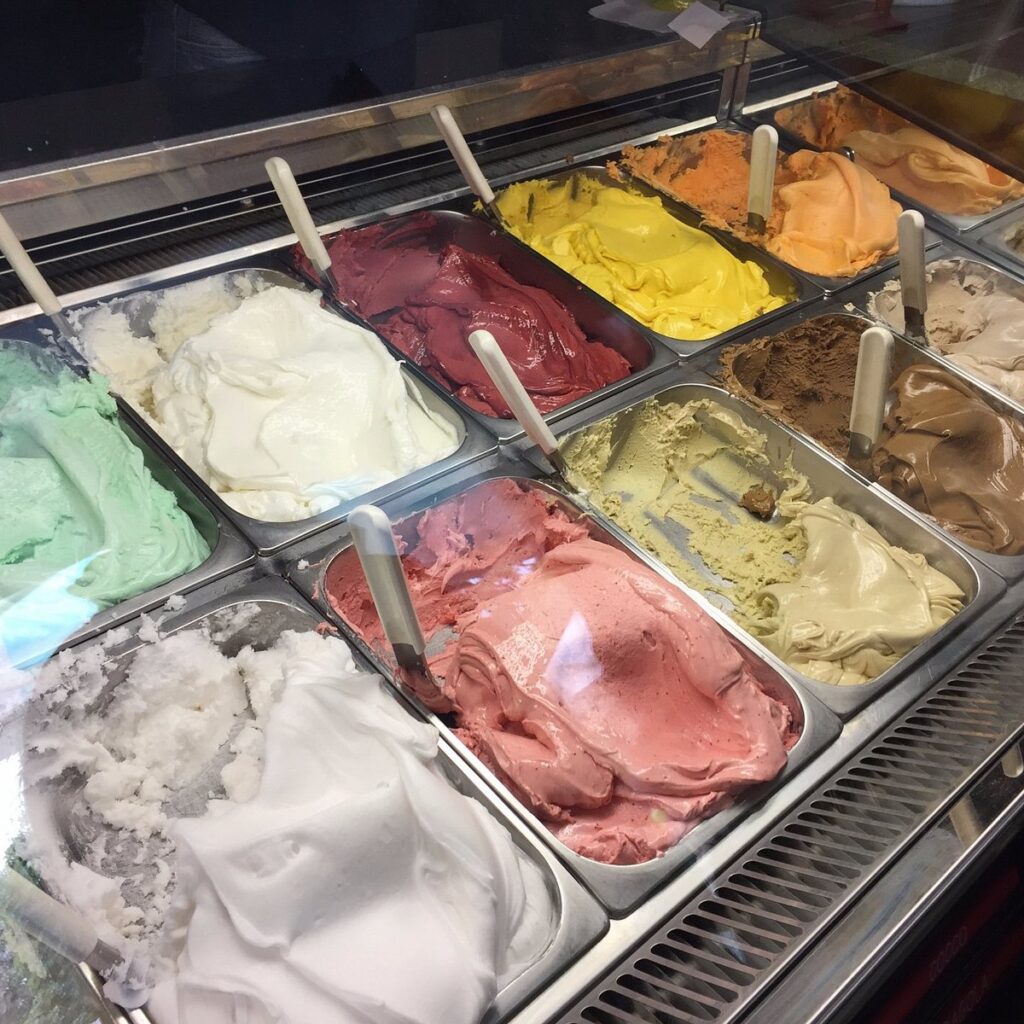 Rows of gelato flavours at a Menaggio gelateria