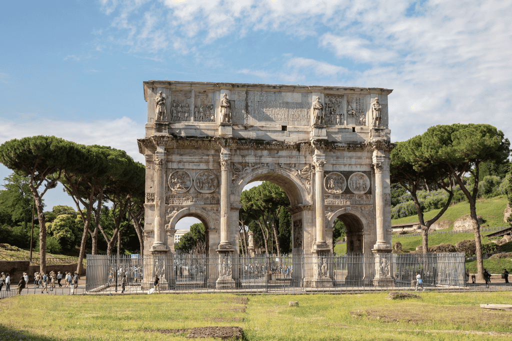The Arch of Constantine standing beside the Colosseum