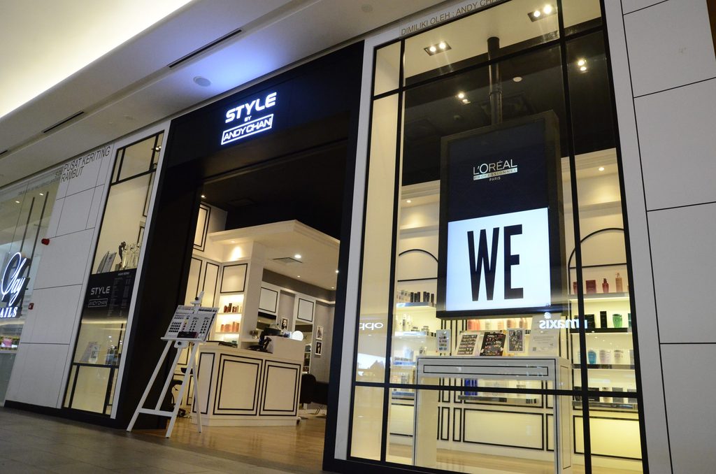 Style by Andy Chan hair salon's glass storefront with L'Oréal Professional signage