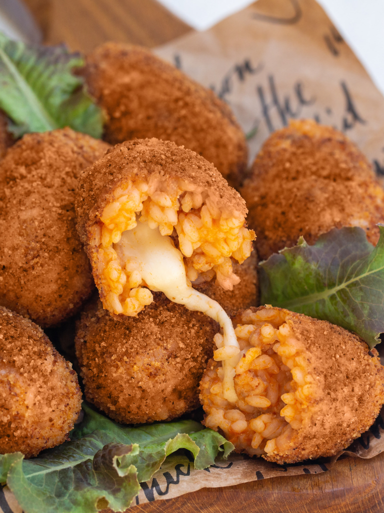 Supplì, fried rice balls with a molten mozzarella centre