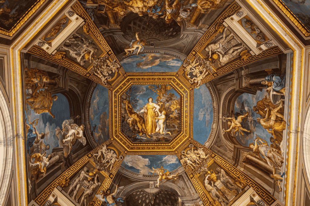 A grand gallery inside the Vatican Museums lined with sculpture