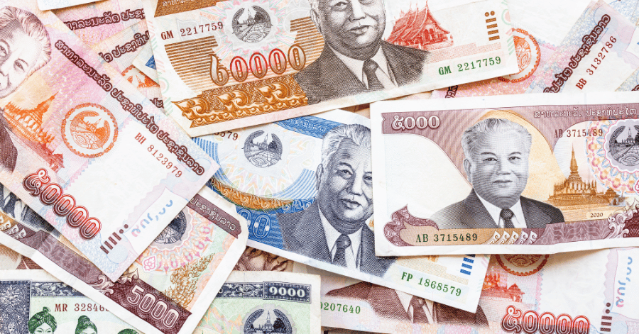 A fan of Lao kip banknotes in different denominations, showing the currency's portrait design