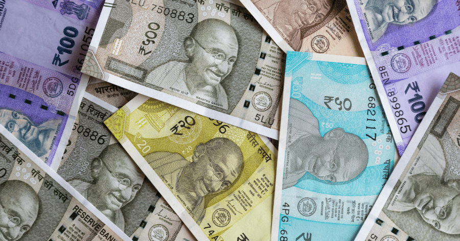 Indian rupee banknotes in various denominations featuring Mahatma Gandhi
